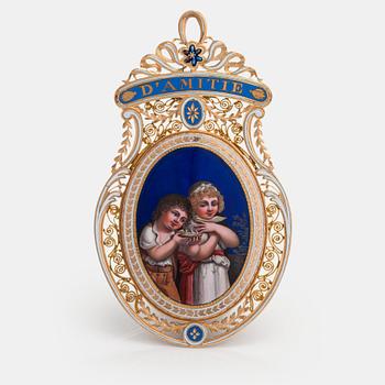 An 18K and 23 K pendant with enamel and miniature painting in qouache.  Probably France, 19th century.