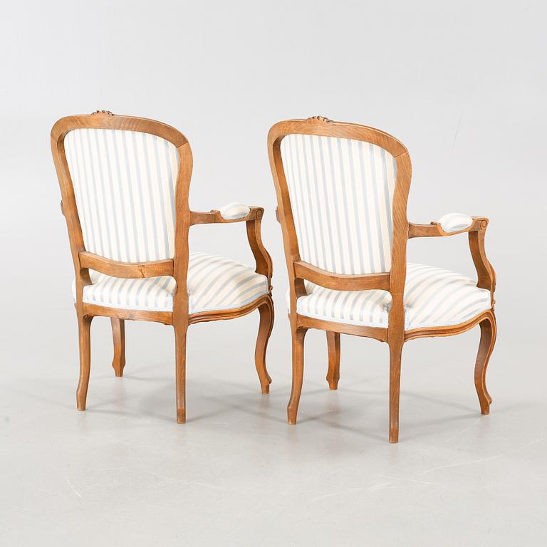 A pair of mid 20th century armchairs.