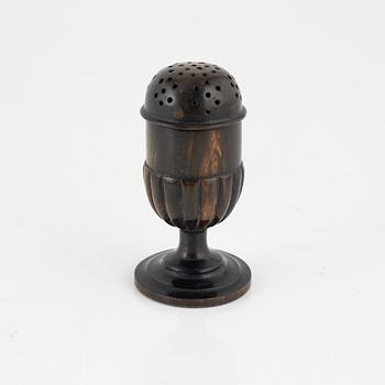 A 18th Century horn saltshaker.