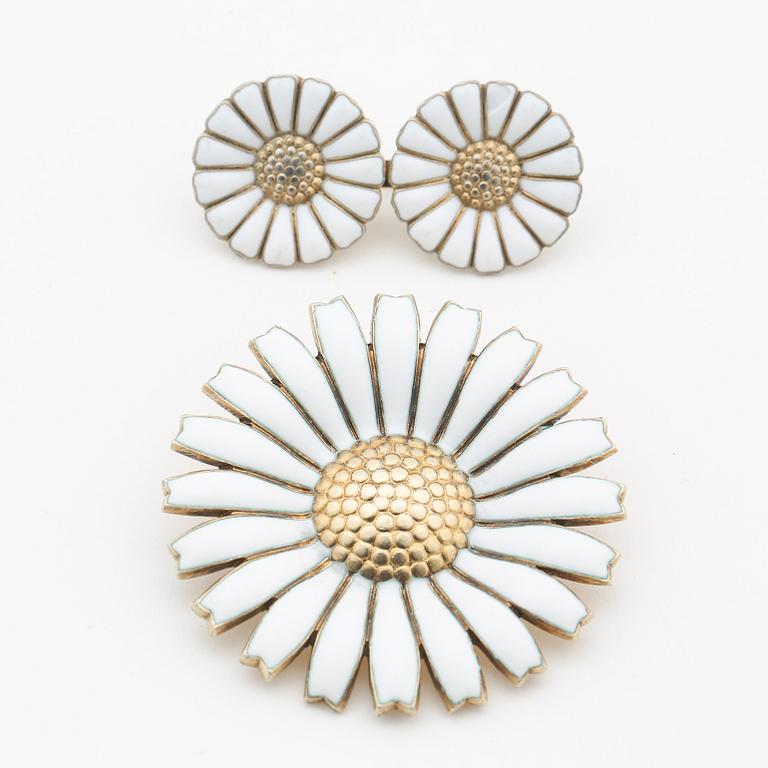 GEORG JENSEN, "Daisy", brooches, silver with enamel.