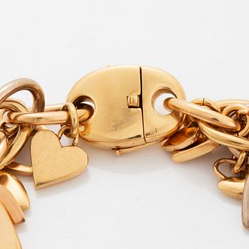 An 18K gold Gaudy bracelet with heart shaped charms.