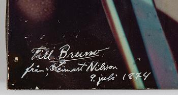 Lennart Nilsson, a photography on board, signed, with dedication and dated 1974.