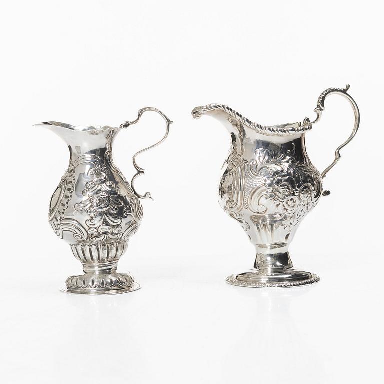 Two creamers, a tray, and a sugar tongs, silver, Rococo and Rococo style, 18th-19th century.