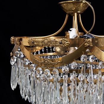 An end of the 20th Century ceiling light with prisms.