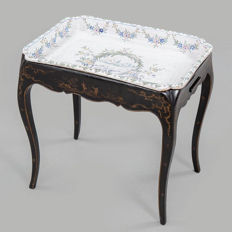 A Swedish Rococo faience tea table, Marieberg 1770.