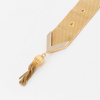 An 18K gold bracelet.