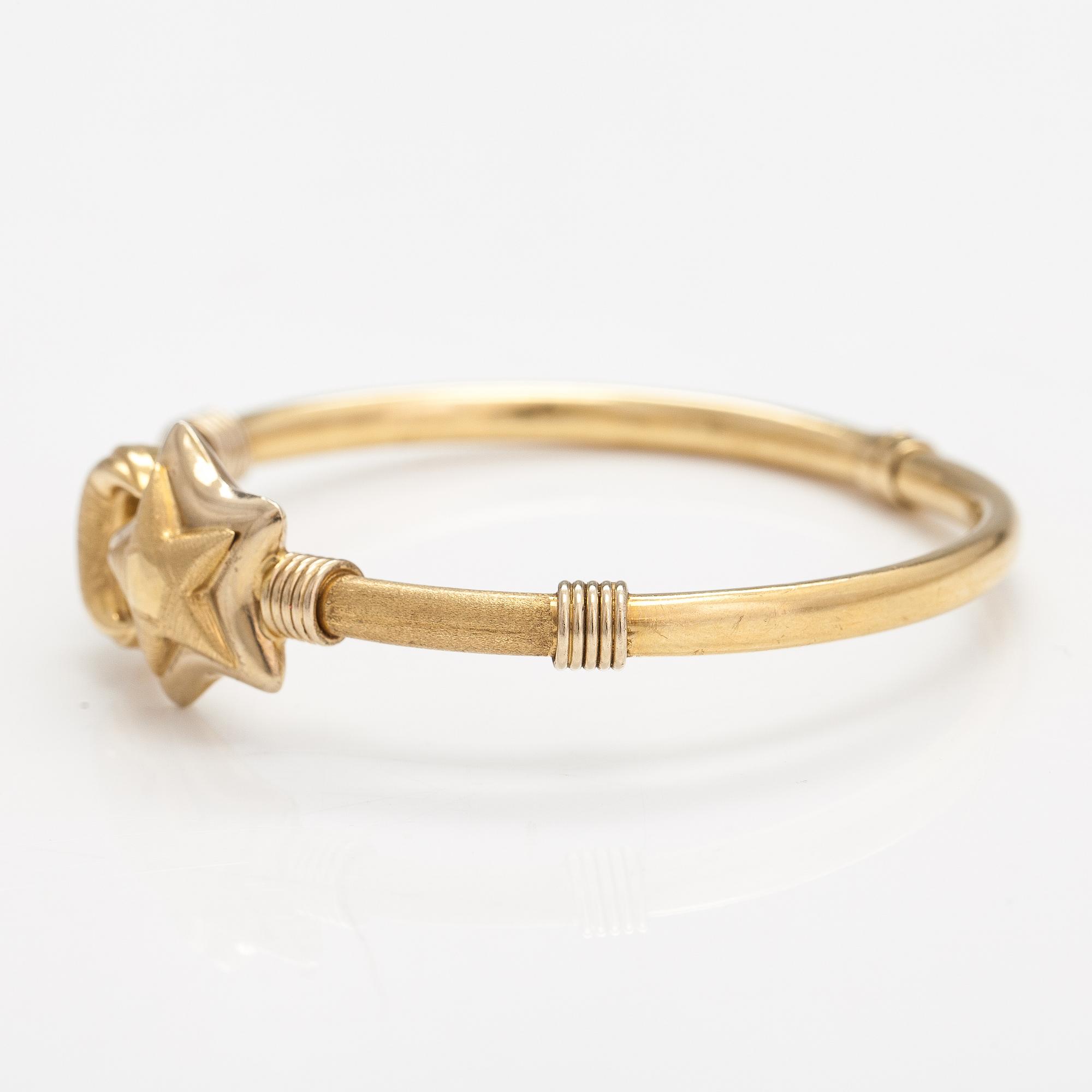 An 18K gold bracelet.