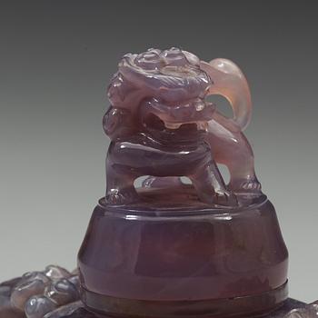 An amethyst tripod censer with cover, China, early 20th Century.