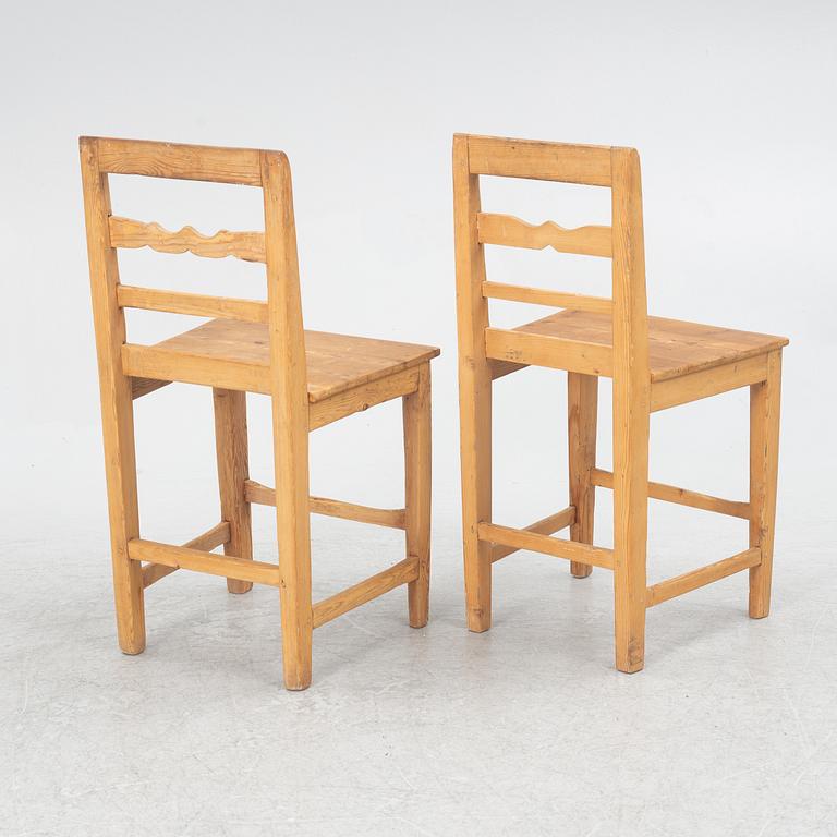 A gateleg table eith 6 + 6 chairs.