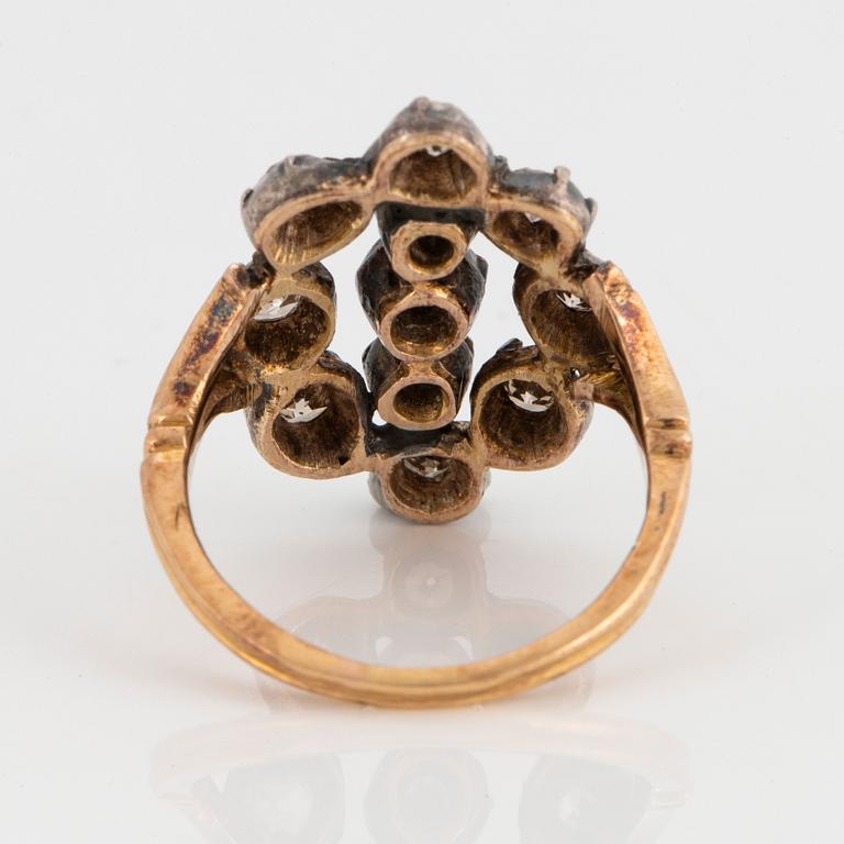 An 18K gold and silver ring set with old-cut diamonds.