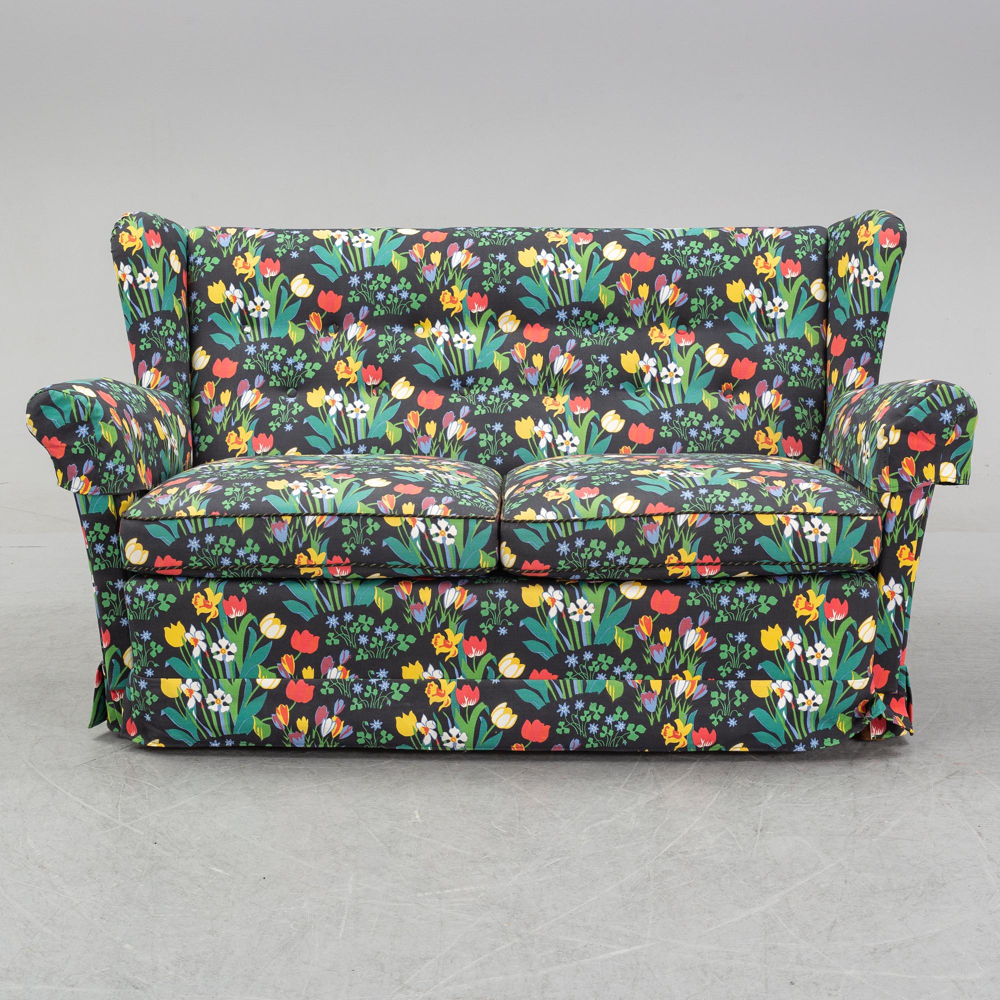 A sofa and wingback chair, later part of the 20th Century.