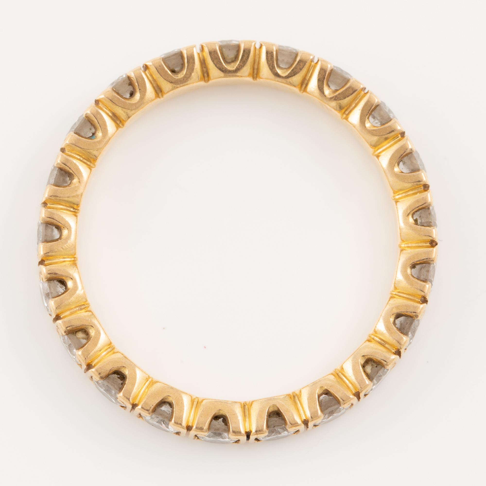 Ring in 18K gold set with round brilliant-cut diamonds, eternity band.