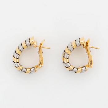 A pair of Bulgari "Tubogas" earrings in 18K gold and steel.