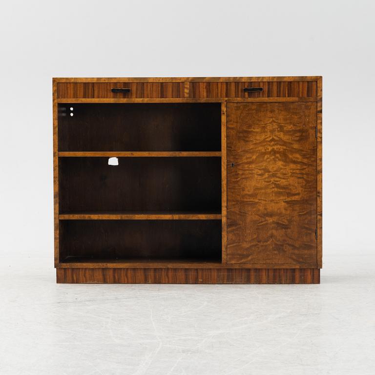 A stained birch veneered bookcase with cabinet, 1930's.