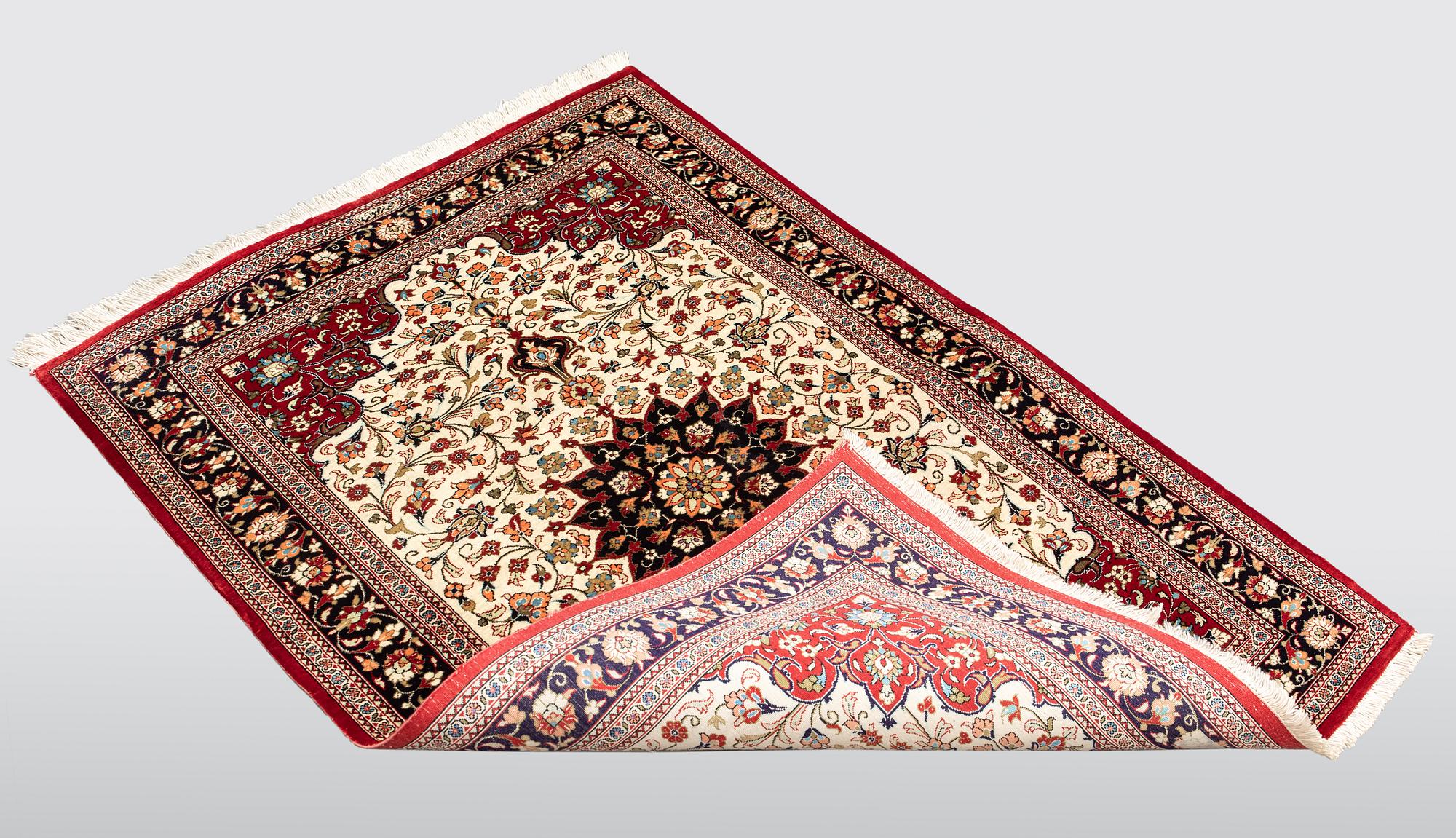 A carpet, Silk Qum, ca 116 x 75 cm.