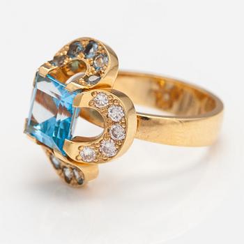 An 18K gold ring "Catherine Jagiellon" with diamonds ca 0.37 ct in total and topazes. Ofelia Jewelry, Helsinki 1998.