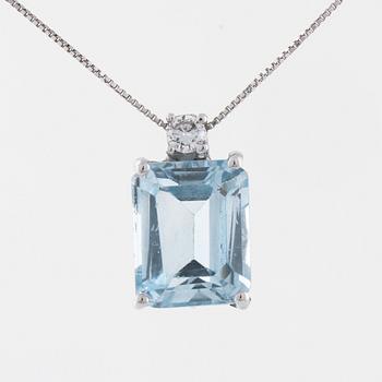 A aquamarine and briliant cut diamond pendant.