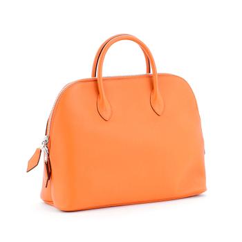 HERMÈS, a orange calf leather handbag, "Bolide".