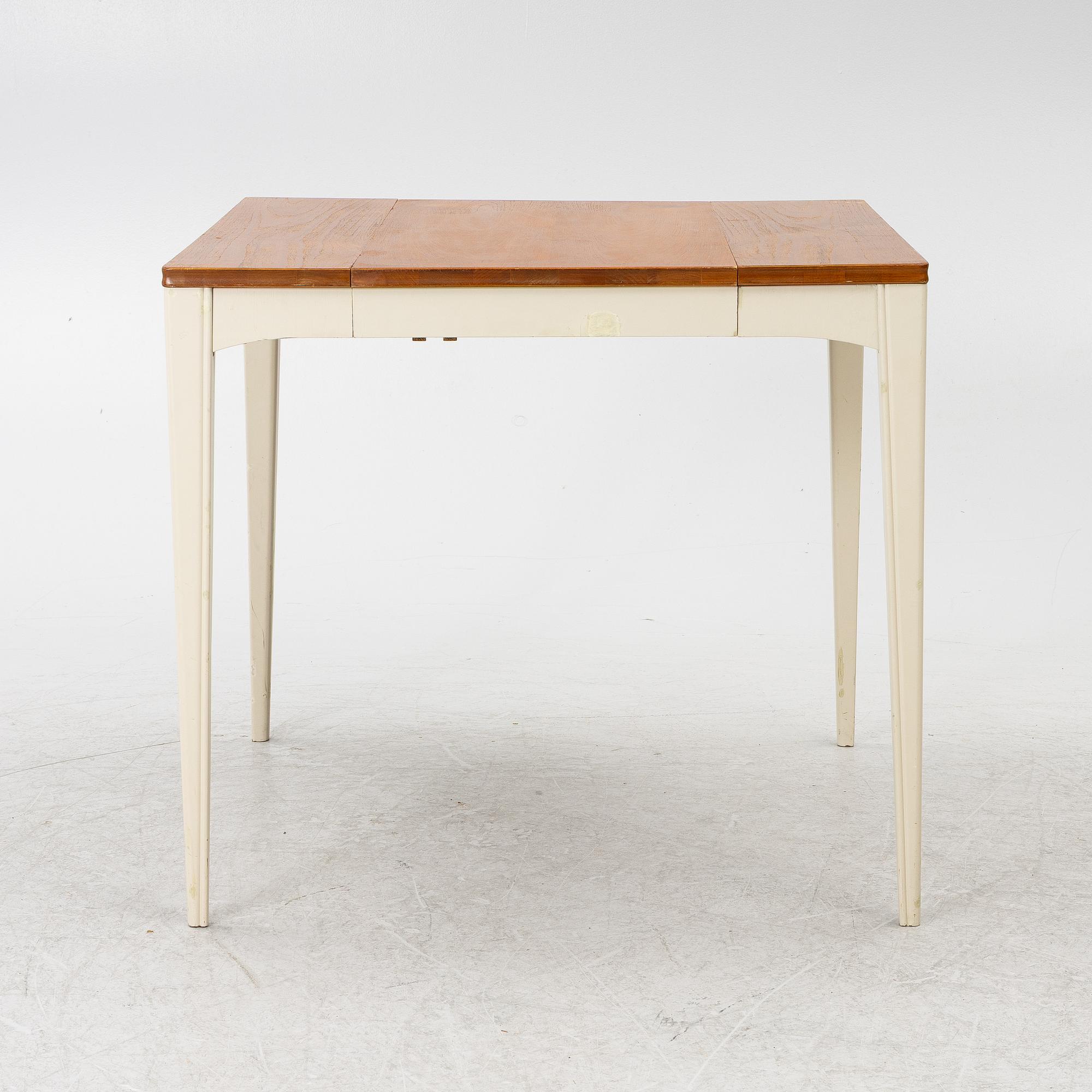 A dining table, mid-20th century.