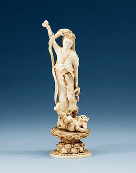 1493. An ivory figure of Guanyin, Qing dynasty. Signed at base.