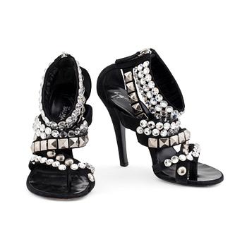 BALMAIN, a pair of black suede sandals with decorative embellishment.