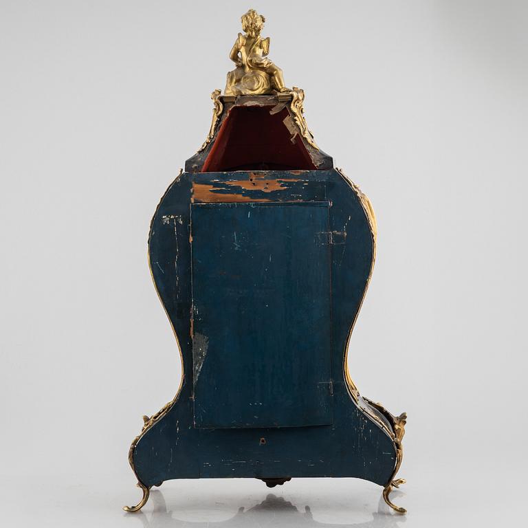 Clock, Rococo style with partially older parts, around the year 1900.