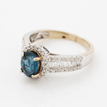 Oval faceted kyanite and diamond ring.