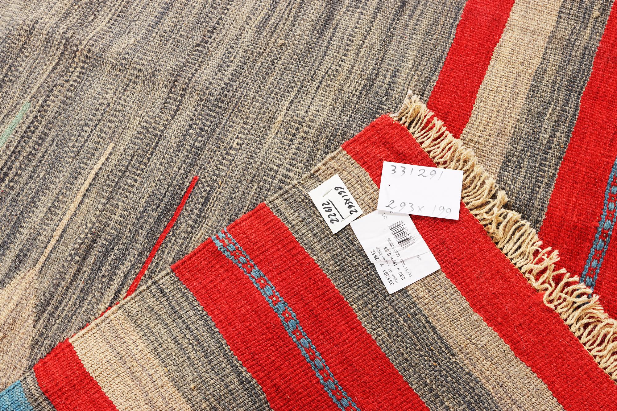 An Afghan Kilim carpet, c. 293 x 199 cm.