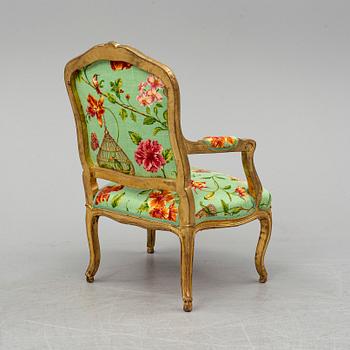 A late 20th century rococo-style armchair.