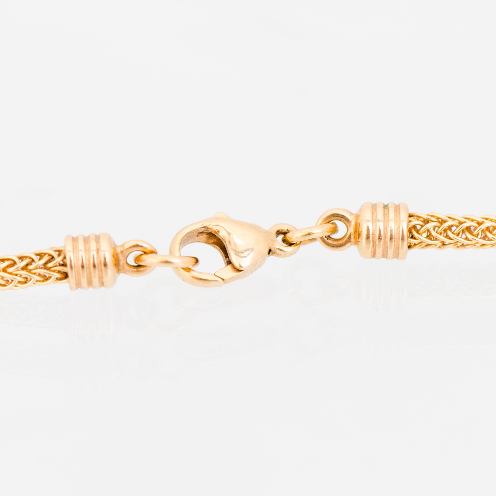 KAULAKORU, "Aurinkoleijona", 18K kultaa. Kalevala Koru 1998.