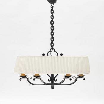 A wrought iron chalet style mid 20th C chandelier.