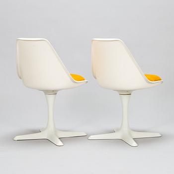 Set of 8 vintage swivel chairs model 115 and a table by Maurice Burke for Arkana, United Kingdom, 1960s.