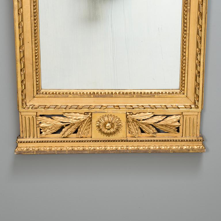 An early 19th century late Neoclassical wall mirror.