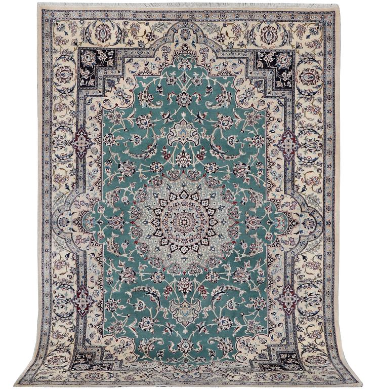 A Nain carpet, part silk, 6 laa, c. 300 x 201 cm.