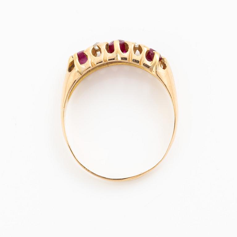 A ring 18K gold with rose-cut diamonds and red stones.