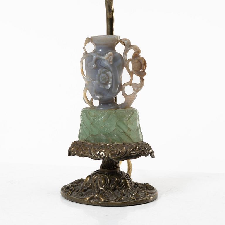 A Chinese table lamp with a carved stone vase with cover, 20th century.