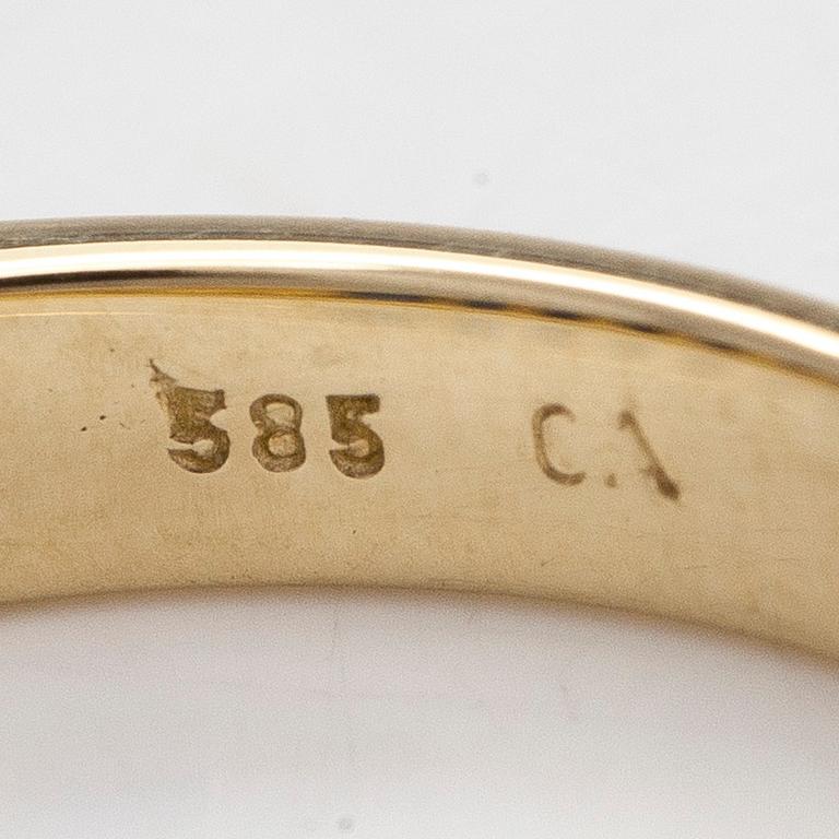 A half-eternity 14K gold ring with sapphires.