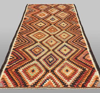 A  Persian nomadic Kilim rug, approx. 300 x 143 cm.