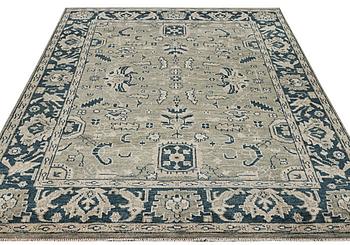 An oriental carpet with Mamluk design, c. 372 x 277 cm.