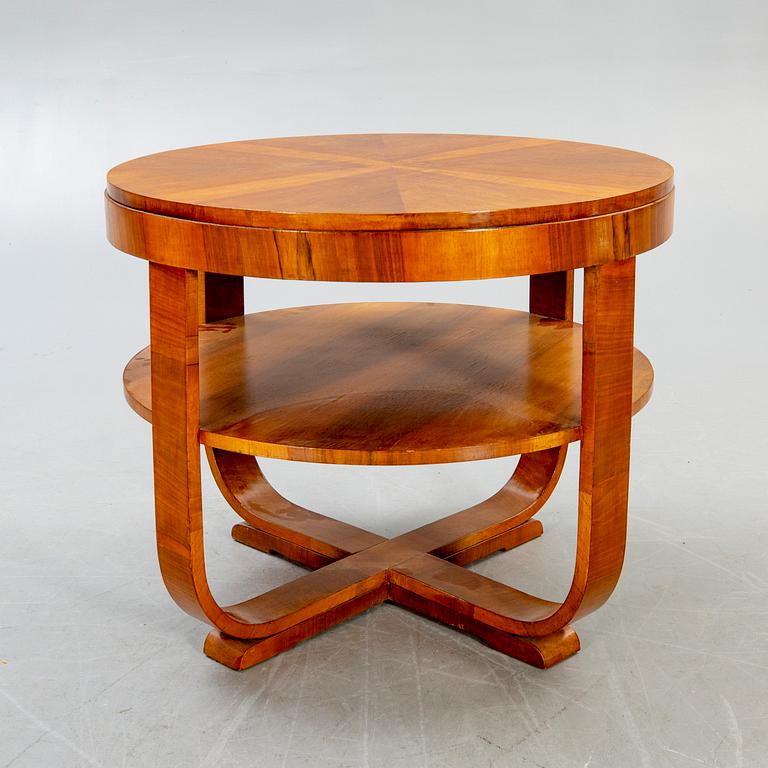 An Art deco style walnut coffee table alter part of the 19th century.