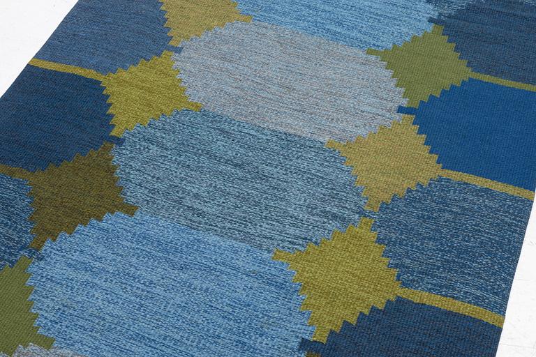 A flat weave carpet, c. 252 x 153 cm signed BS.