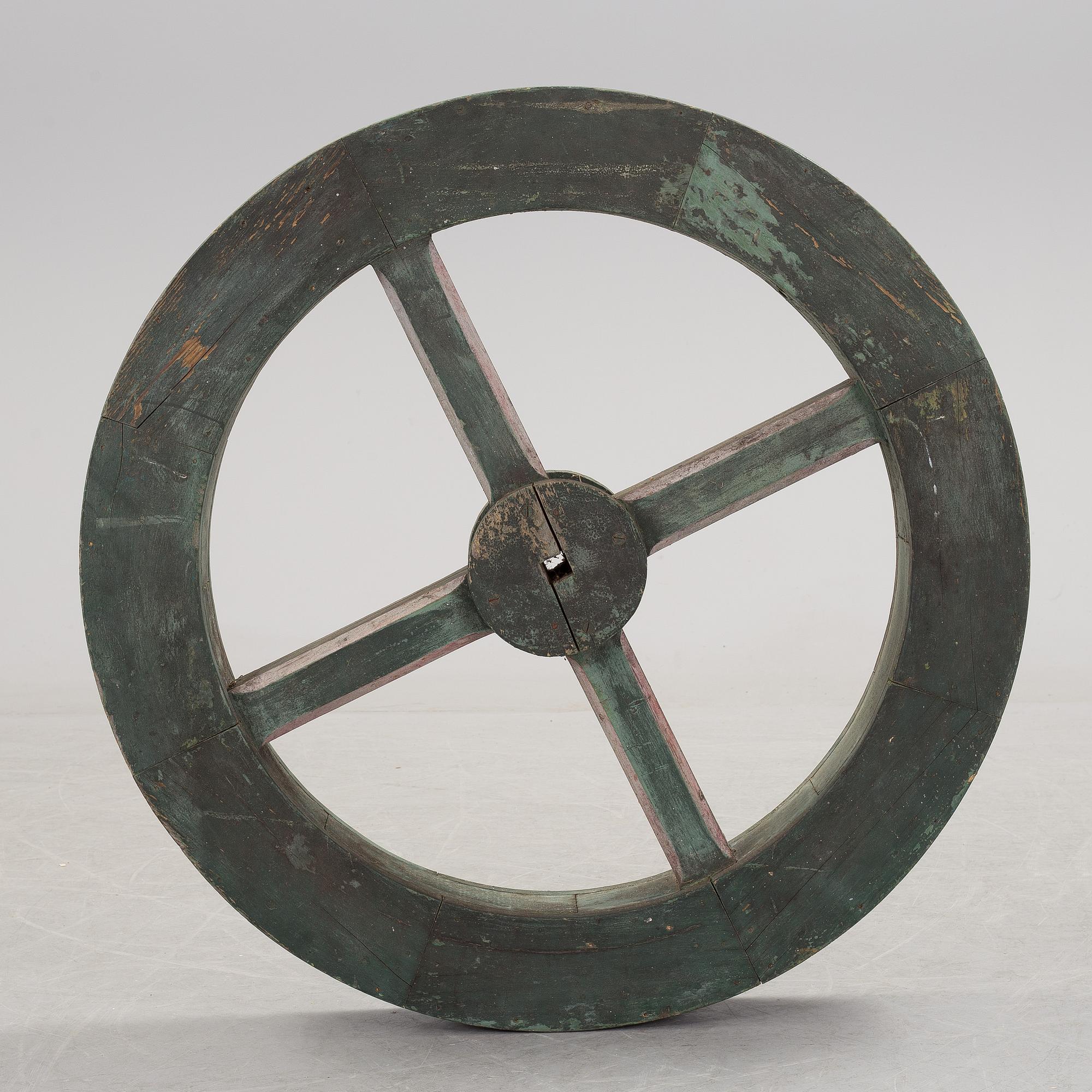 A early 20th century wooden wheel.