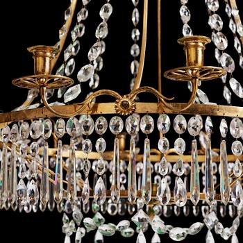 A German Louis XVI ormolu and cut-glass nine-light chandelier attributed to Johann Christoph Ermisch, late 18th century.