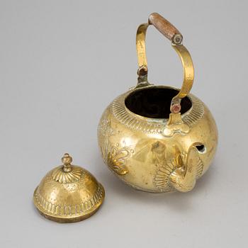 A 18th century brass tea pot.