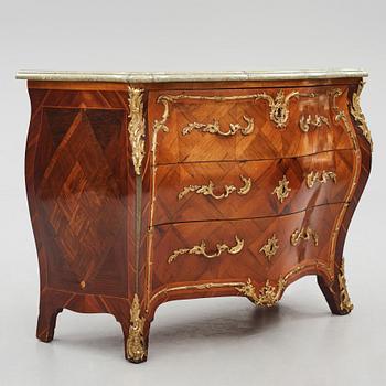 A rococo parquetry and ormolu-mounted commode attributed to L. Nordin (master 1743-1773).