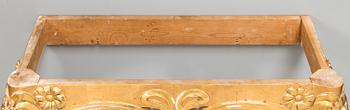 An Art Nouveau mirror with console table from early 20th century.