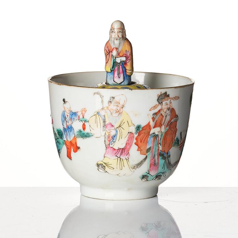 A famille rose 'trick cup' with a little figure, Qing dynasty, 19th Century.