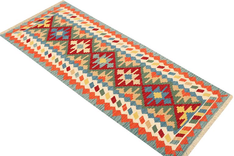 An Afghan kilim runner, c. 200 x 80 cm.