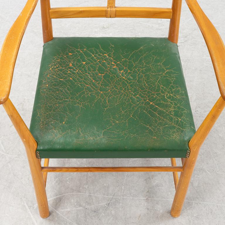 Josef Frank, a model 2238 cherry wood armchair by Firma Svenskt Tenn.