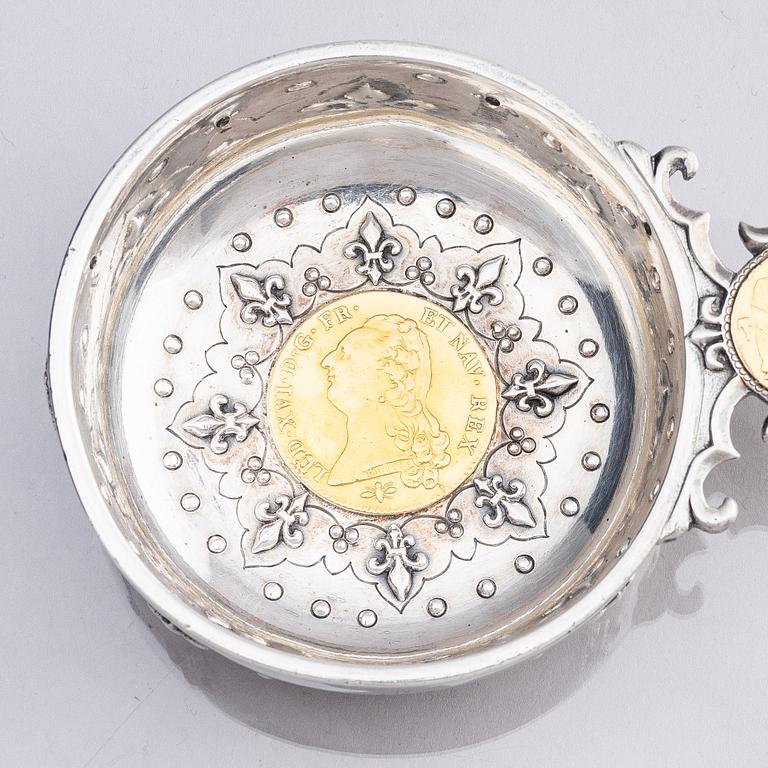 An 18th century French parcel-gilt silver tasse du vin (wine taster).